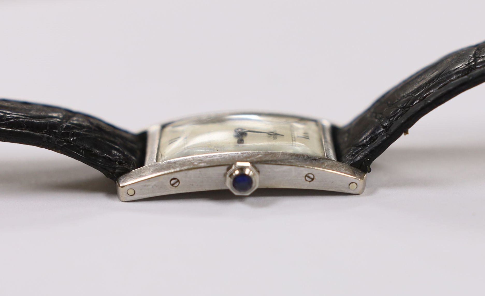 A 1920's 18ct white gold Cartier Tank Cintree (7 lignes model) manual wind wrist watch, with later 1970's movement and crown